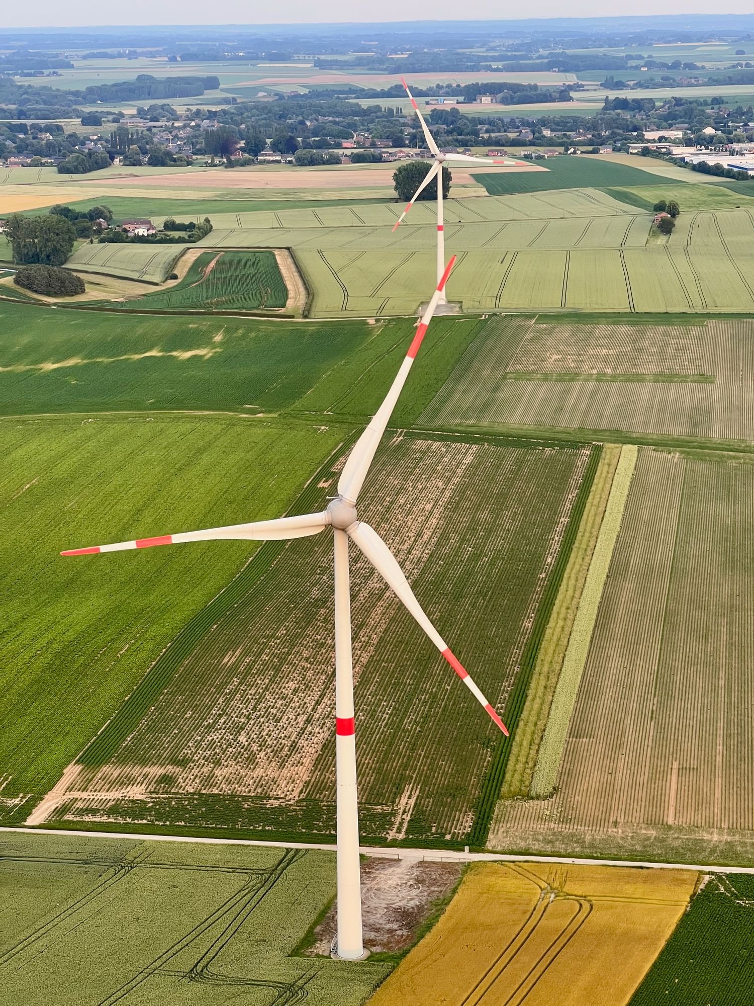 Agricultural land and wind turbines viewed from above